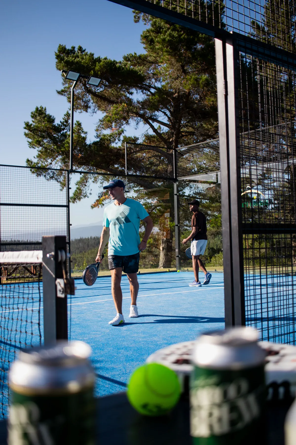 Two padel players on an outdoor court